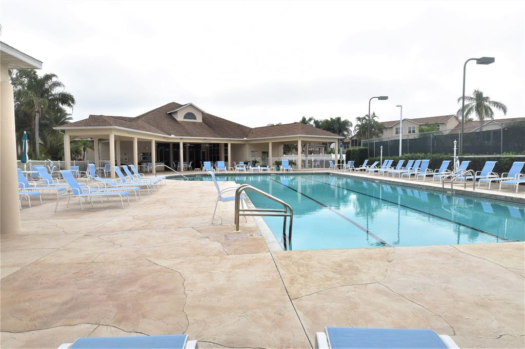 4235 Castle Bridge, Unit 1216 Sarasota, FL 34238 - Photo 10 of 18 a view of a house with a swimming pool
