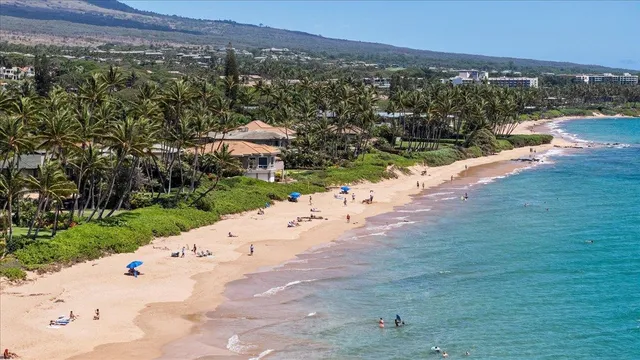 a kitchen with granite countertop a refrigerator and a sink