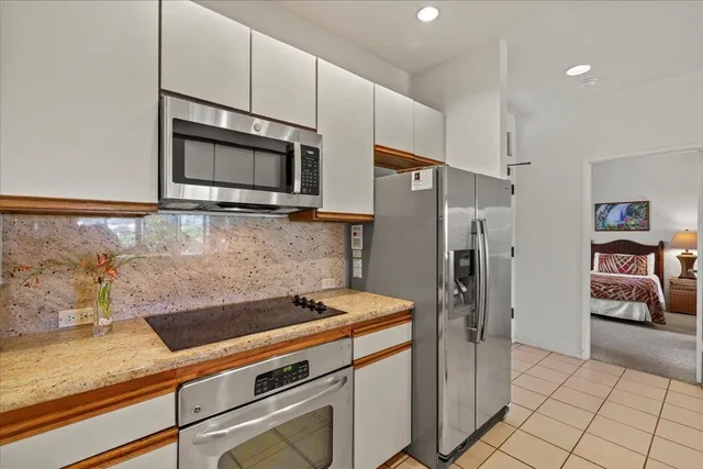 a bedroom with a bed and a couch