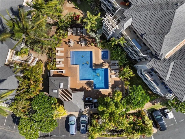 a bathroom with double vanity sinks and a mirror