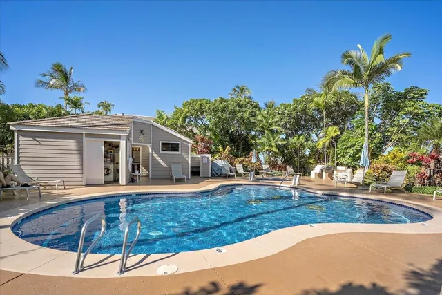 an aerial view of a house with swimming pool