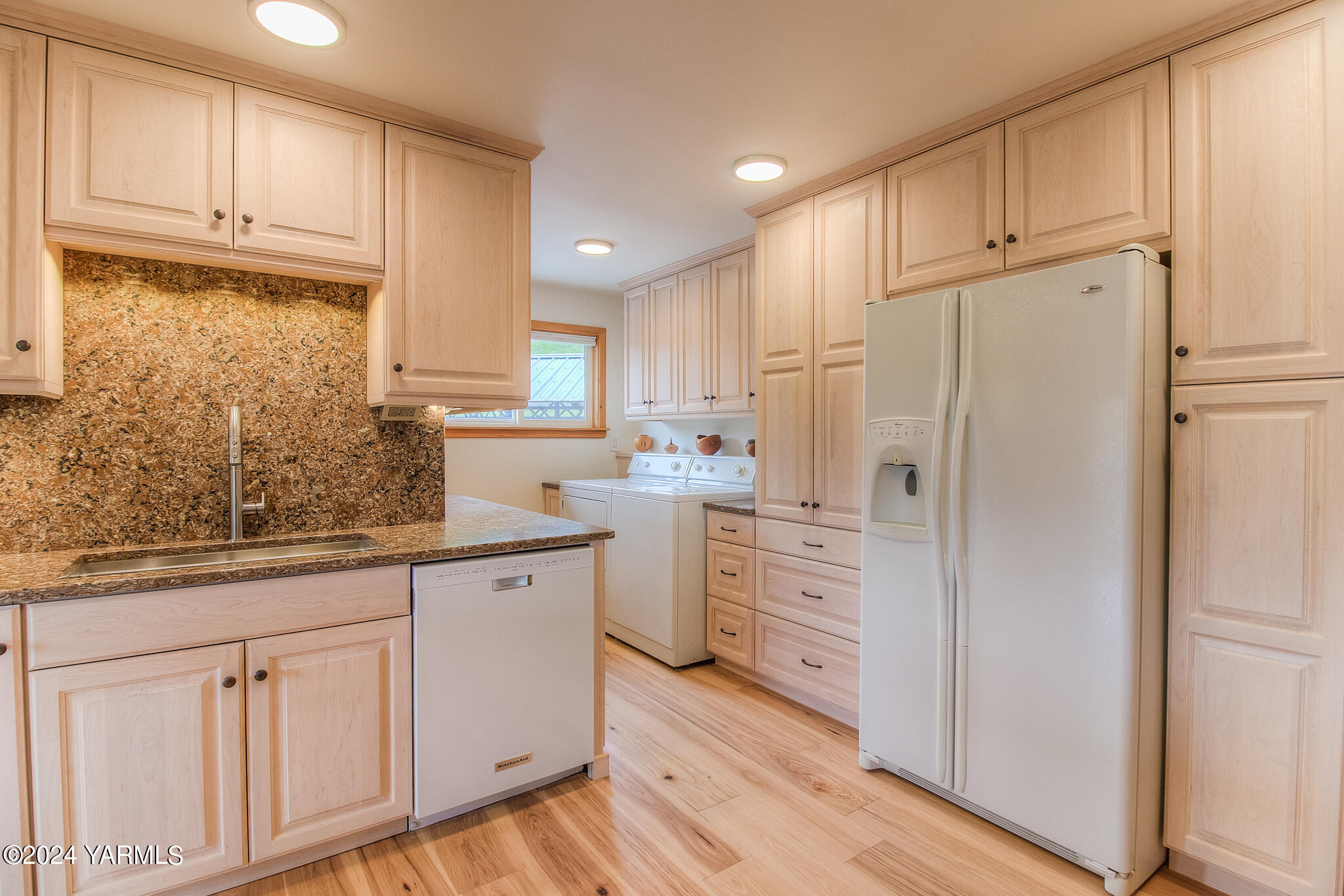 1071 Humphrey Road Tieton, WA 98947 - Photo 11 of 40 a kitchen with white cabinets and white appliances