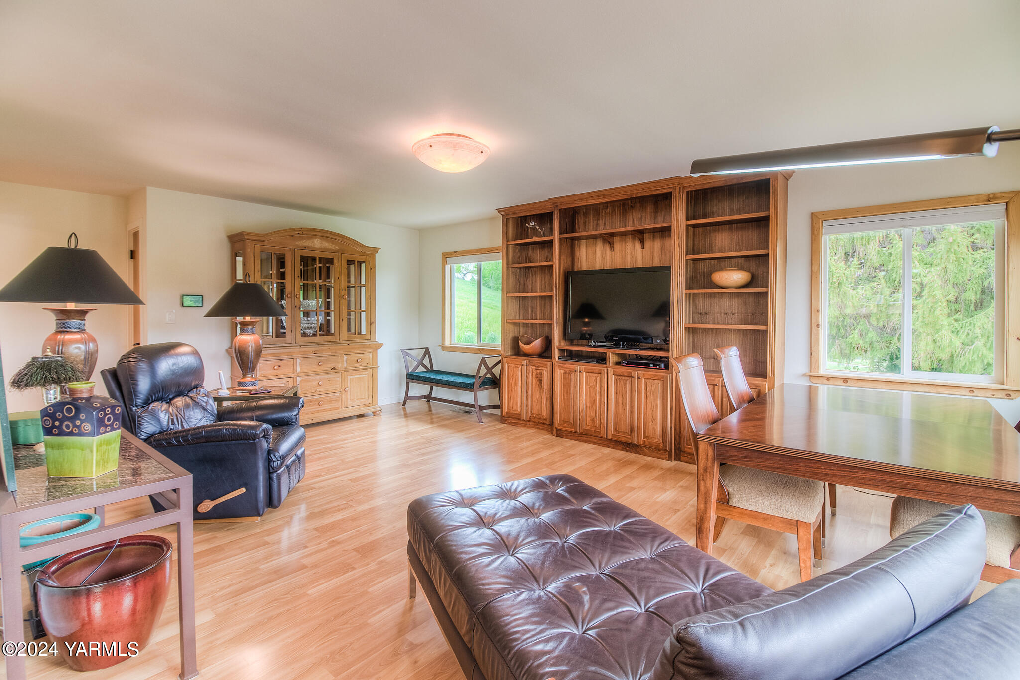 1071 Humphrey Road Tieton, WA 98947 - Photo 12 of 40 a living room with furniture floor to ceiling window and a flat screen tv