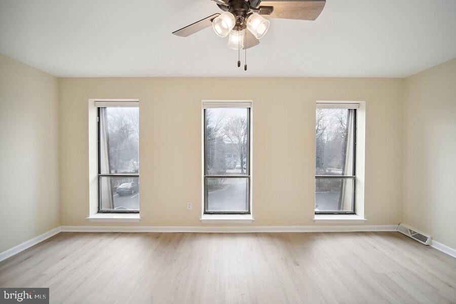 1179 Putnam Boulevard, Unit 3 Wallingford, PA 19086 - Photo 9 of 9 a view of room with window and wooden floor