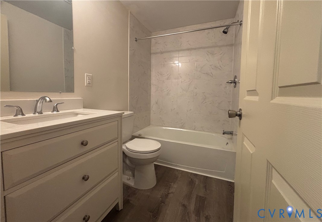 128 North Sylvan Road Waverly, VA 23890 - Photo 13 of 22 Hall bathroom with tub and new vanity.