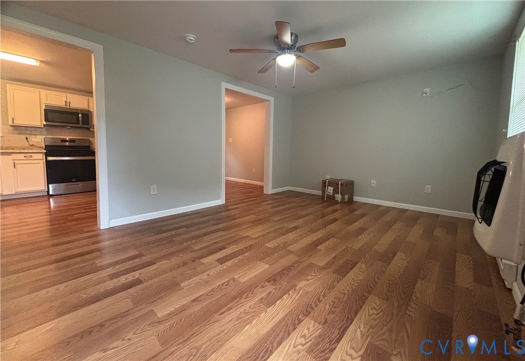 128 North Sylvan Road Waverly, VA 23890 - Photo 4 of 22 Open and bright living room flows nicely into kitc