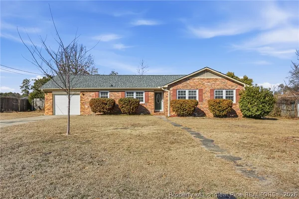 a house with trees in front of it