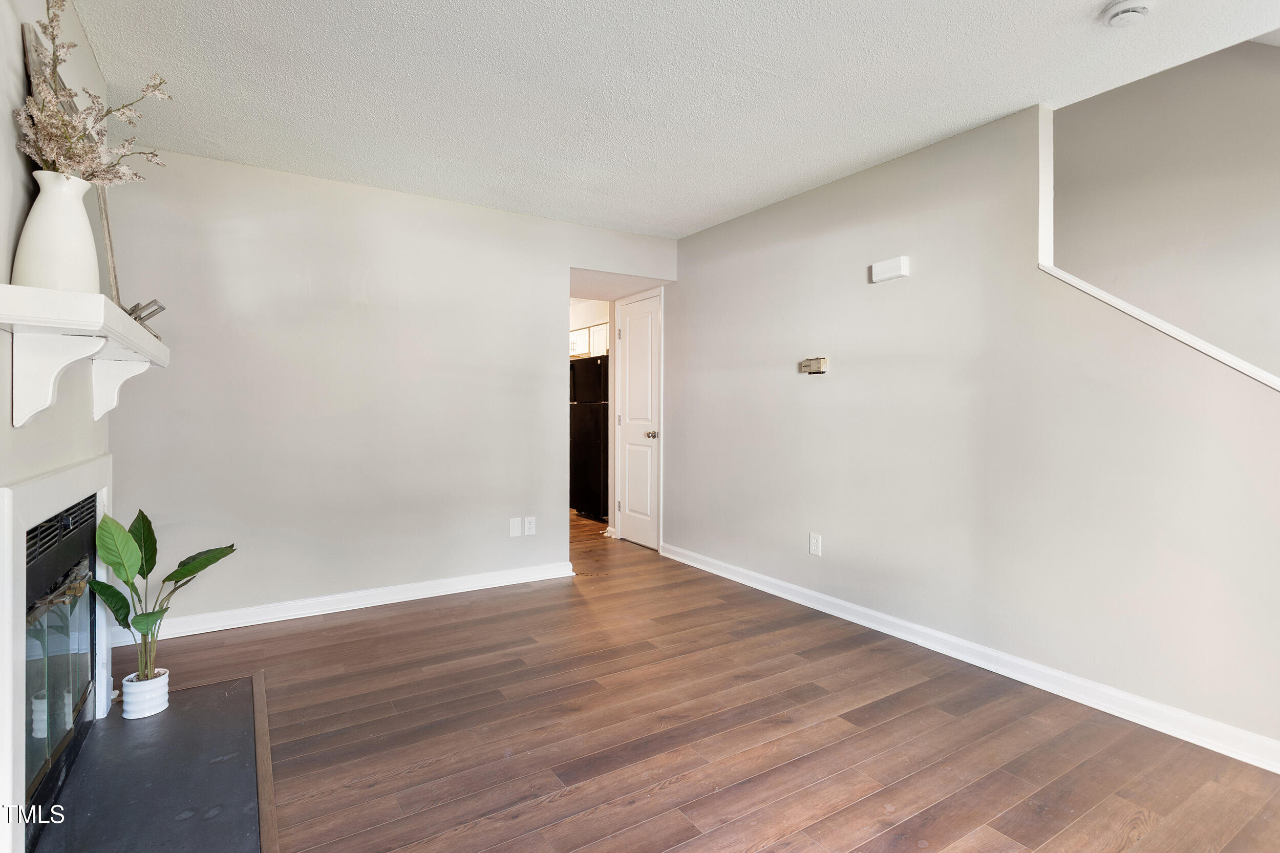 118 Rhum Place Garner, NC 27529 - Photo 14 of 26 a view of an empty room with wooden floor