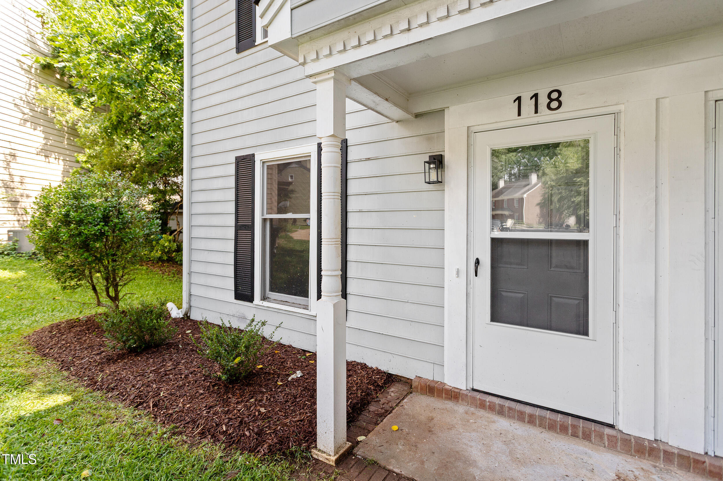 118 Rhum Place Garner, NC 27529 - Photo 2 of 26 a front view of a house with garden