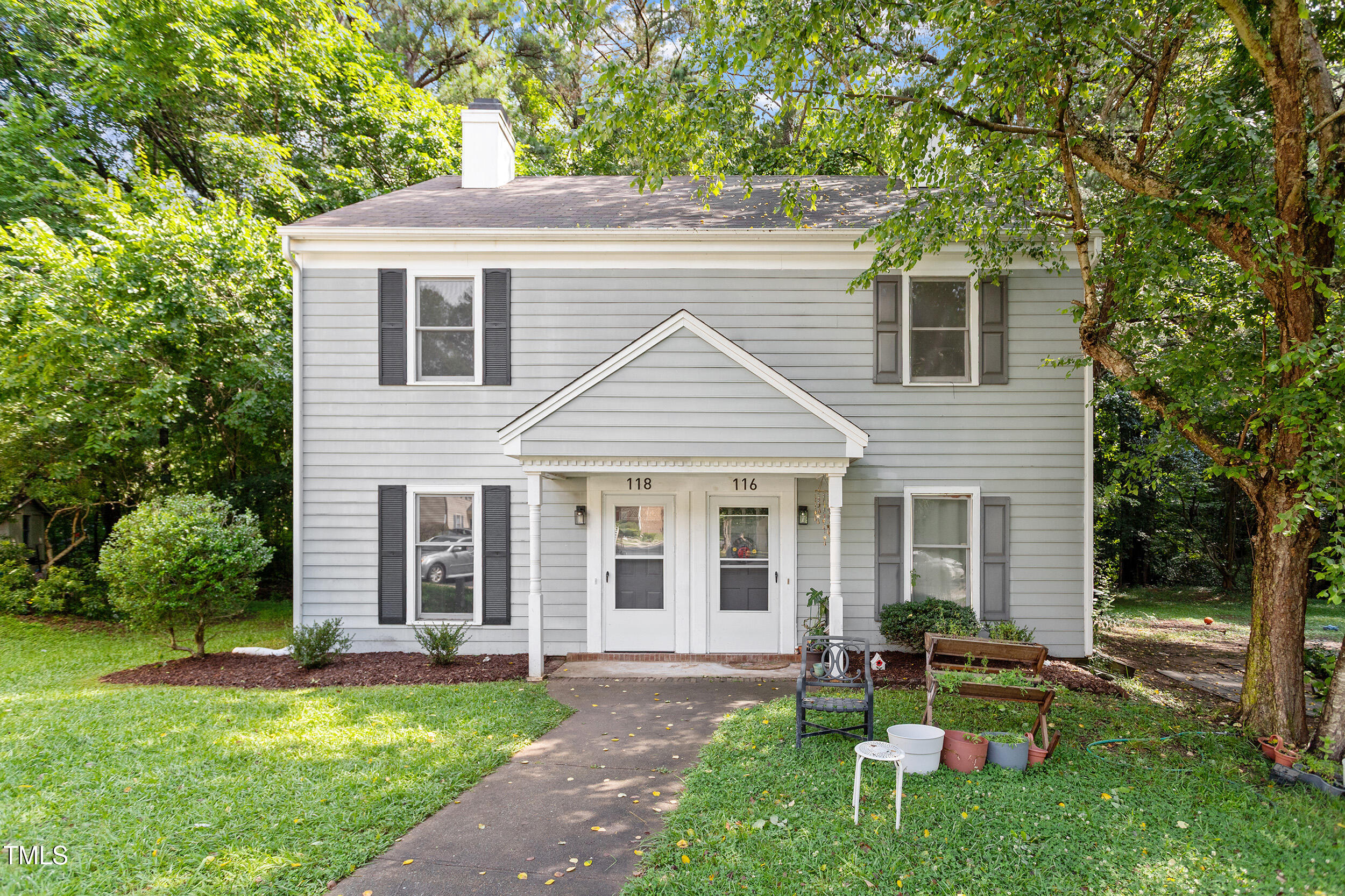 118 Rhum Place Garner, NC 27529 - Photo 25 of 26 a view of a yard in front of a house with plants and large tree