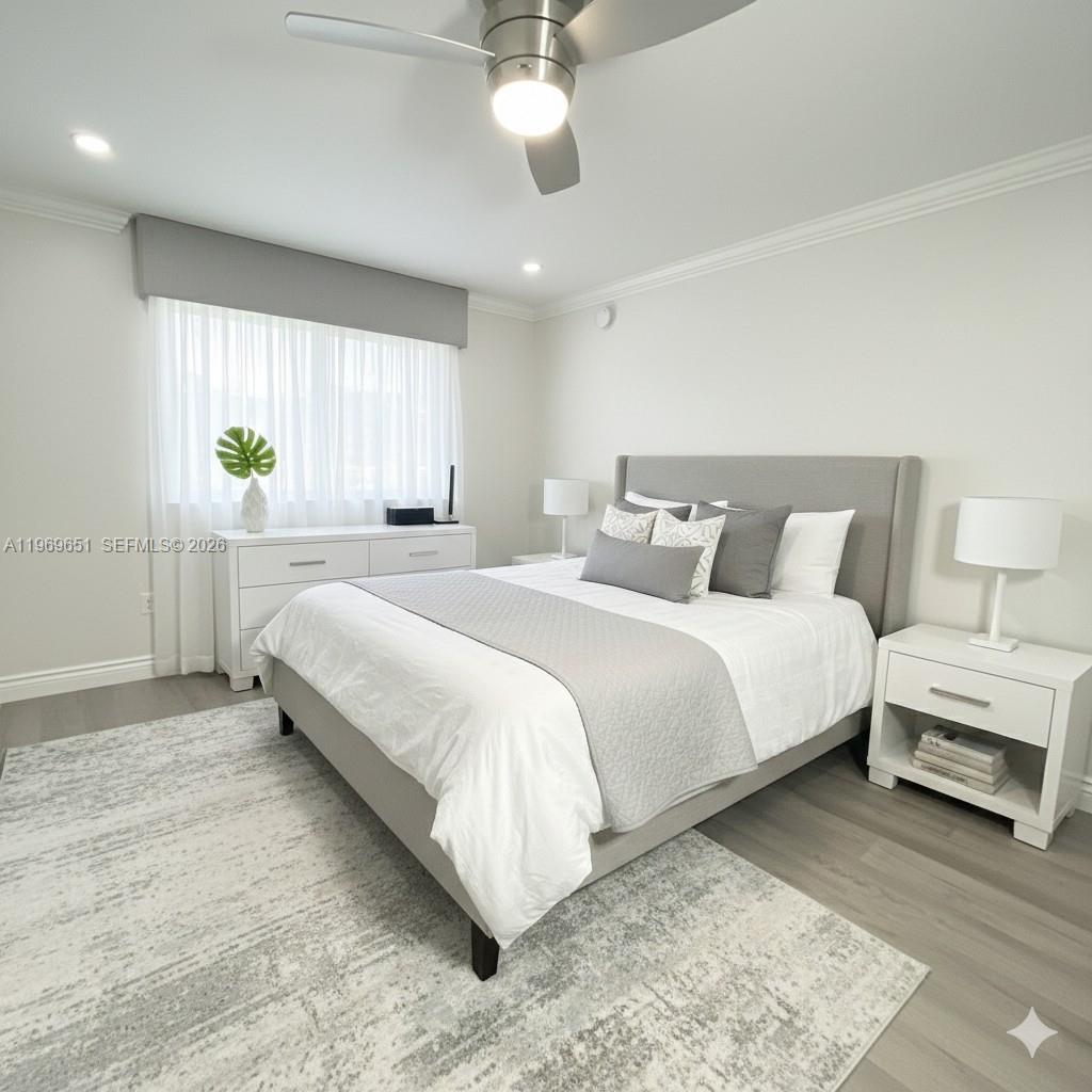 2401 Riverside Drive, Unit 313B Coral Springs, FL 33065 - Photo 3 of 6 a bedroom with a bed and a chandelier