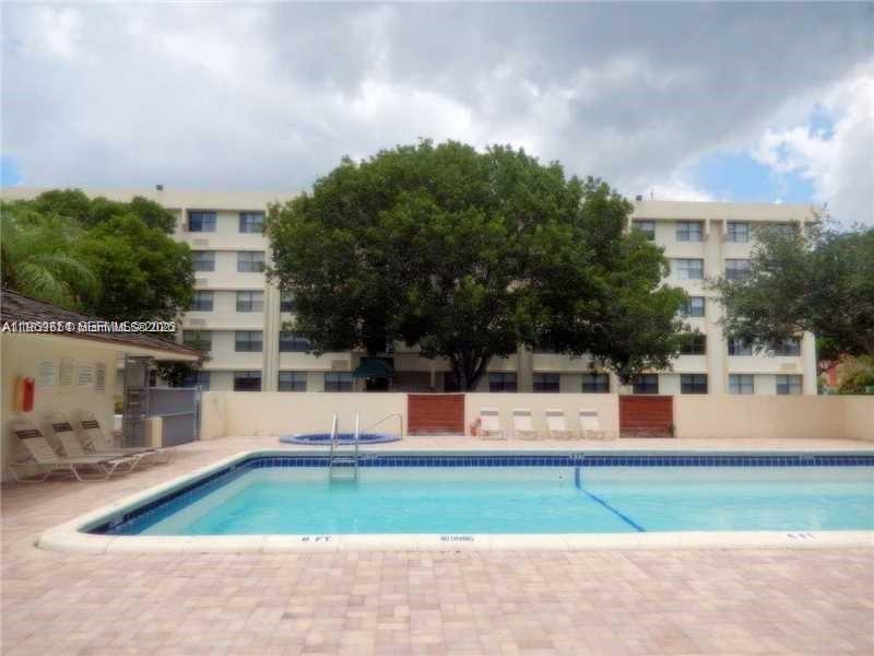 2401 Riverside Drive, Unit 313B Coral Springs, FL 33065 - Photo 6 of 6 a house view with a garden space
