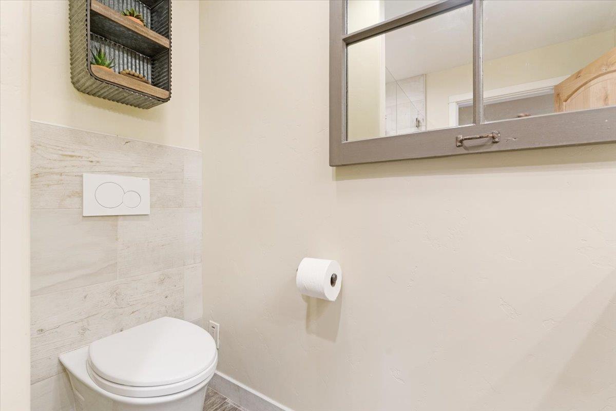 7409 Hihn Road Ben Lomond, CA 95005 - Photo 60 of 101 a bathroom with a toilet a sink and mirror