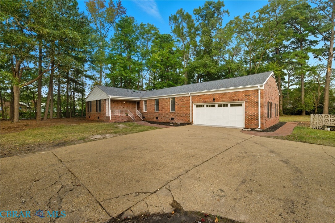 718 Dandy Loop Road Yorktown, VA 23692 - Photo 39 of 42 Ranch-style home with crawl space, concrete driveway, brick siding, a garage, and a front yard
