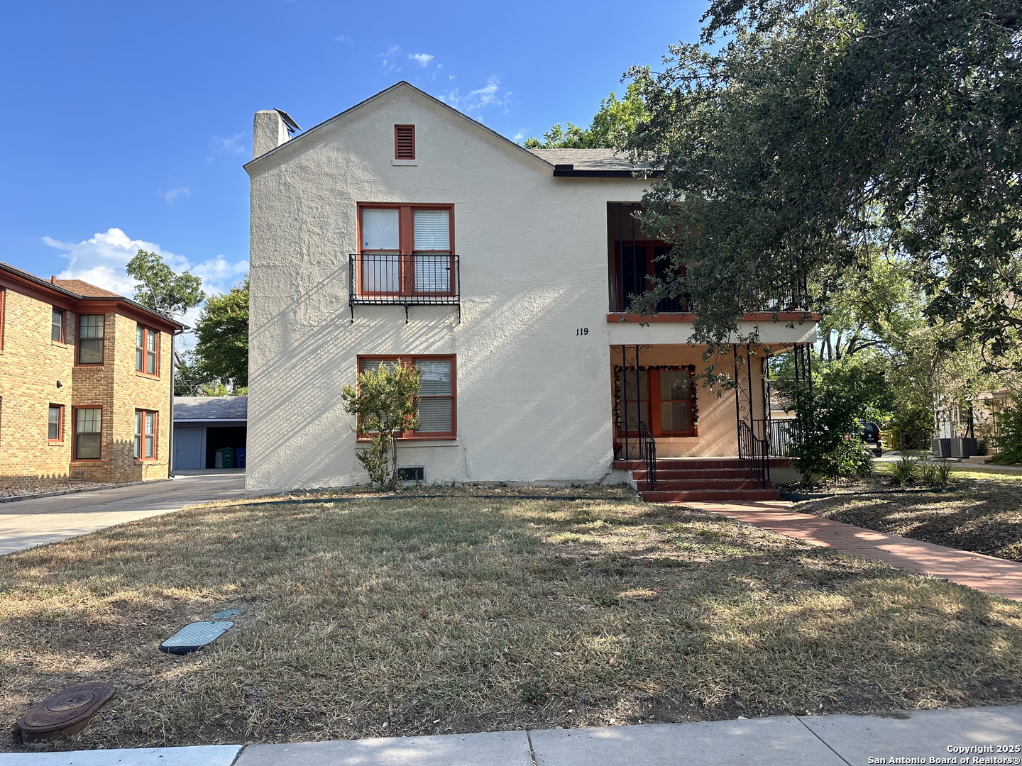 119 East Ridgewood Court, Unit 3 San Antonio, TX 78212 - Photo 1 of 7 a view of a house with a yard