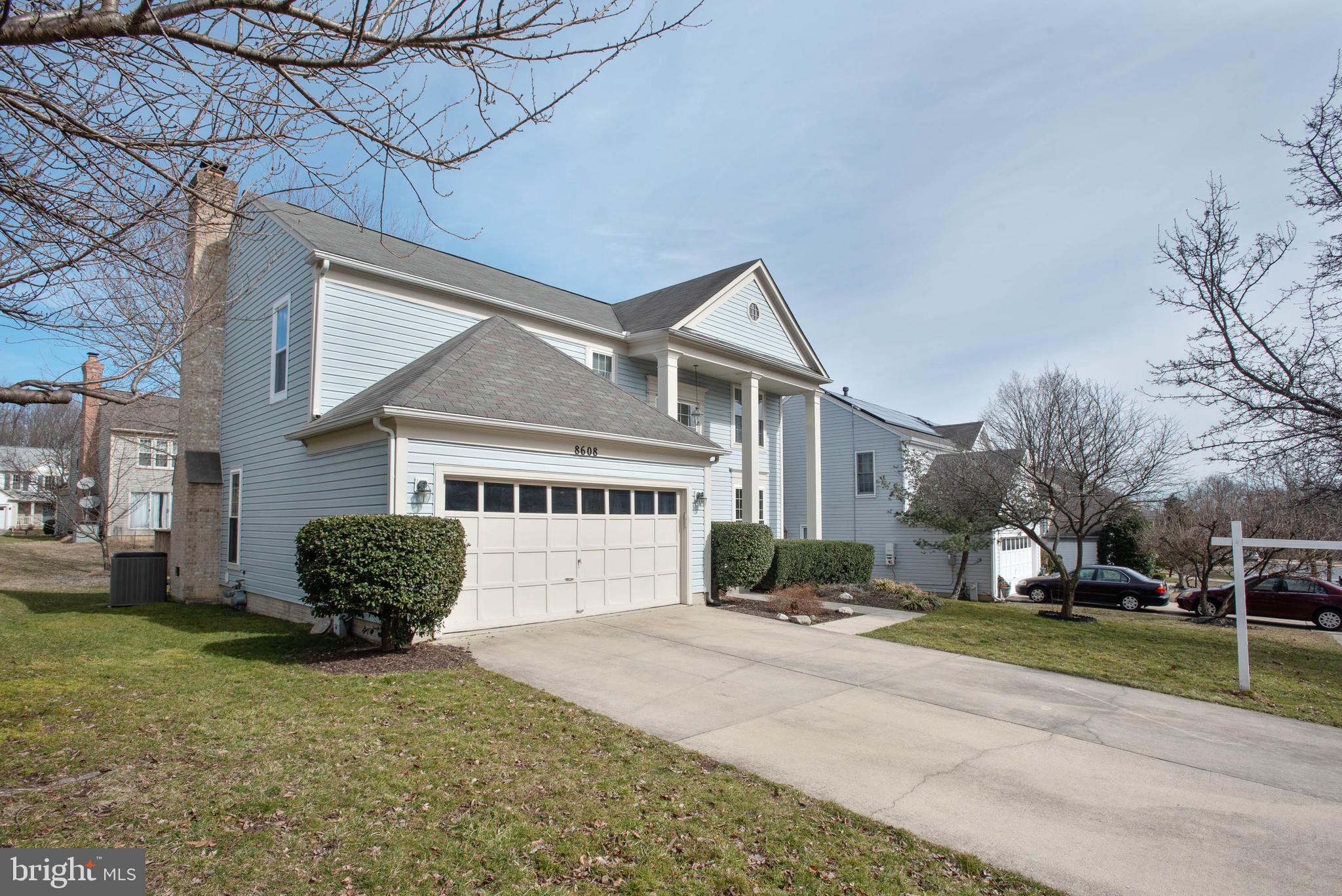 8608 Ashcroft Drive Laurel, MD 20708 - Photo 2 of 45 a front view of a house with a yard