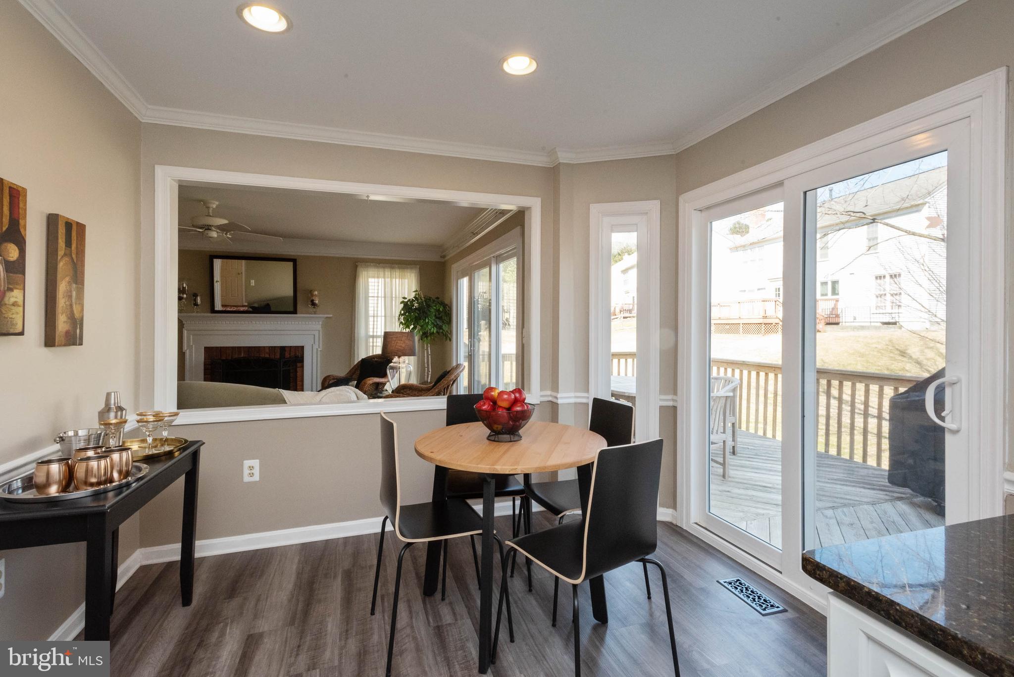 8608 Ashcroft Drive Laurel, MD 20708 - Photo 12 of 45 a dining room with furniture window and wooden floor