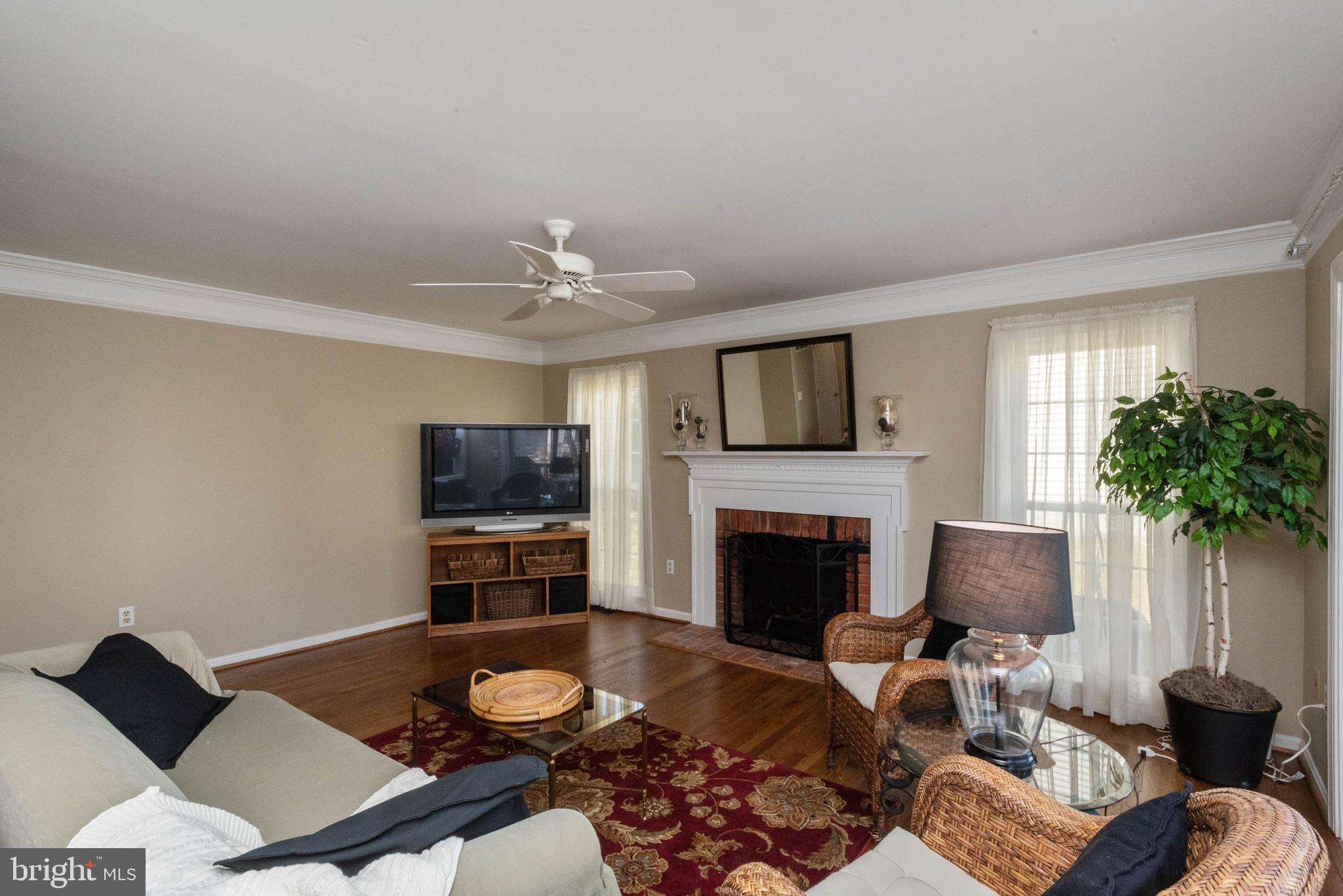 8608 Ashcroft Drive Laurel, MD 20708 - Photo 14 of 45 a living room with furniture and a fireplace
