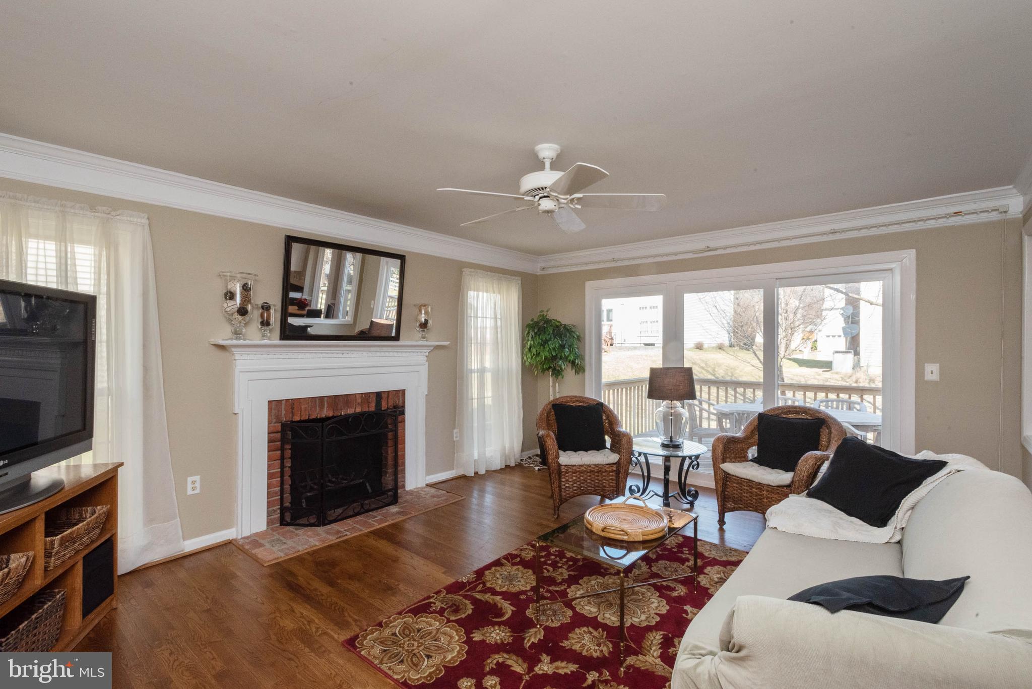8608 Ashcroft Drive Laurel, MD 20708 - Photo 17 of 45 a living room with furniture fireplace and flat screen tv