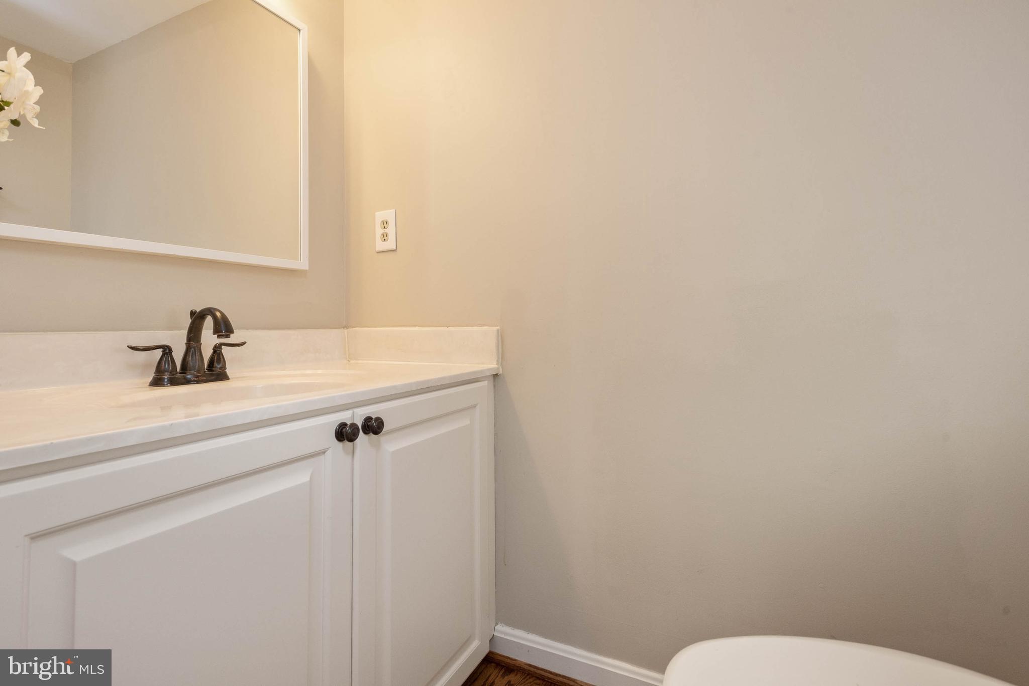 8608 Ashcroft Drive Laurel, MD 20708 - Photo 18 of 45 a bathroom with a sink a toilet