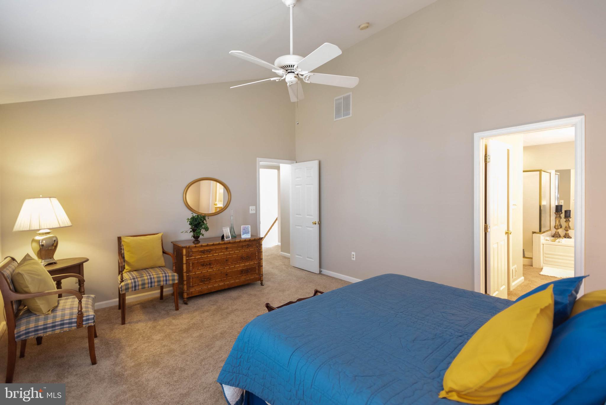 8608 Ashcroft Drive Laurel, MD 20708 - Photo 20 of 45 a bedroom with a bed and a chandelier
