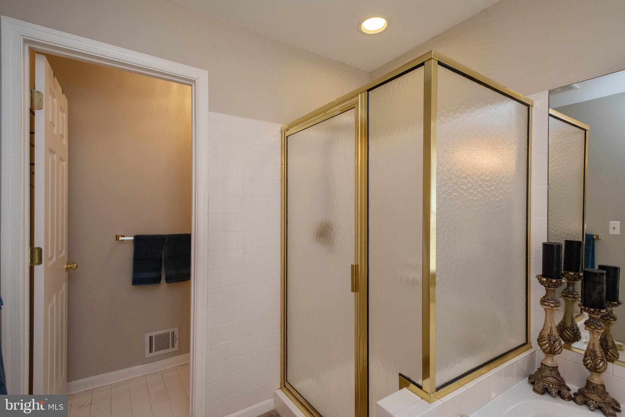 8608 Ashcroft Drive Laurel, MD 20708 - Photo 24 of 45 a bathroom with a glass shower door