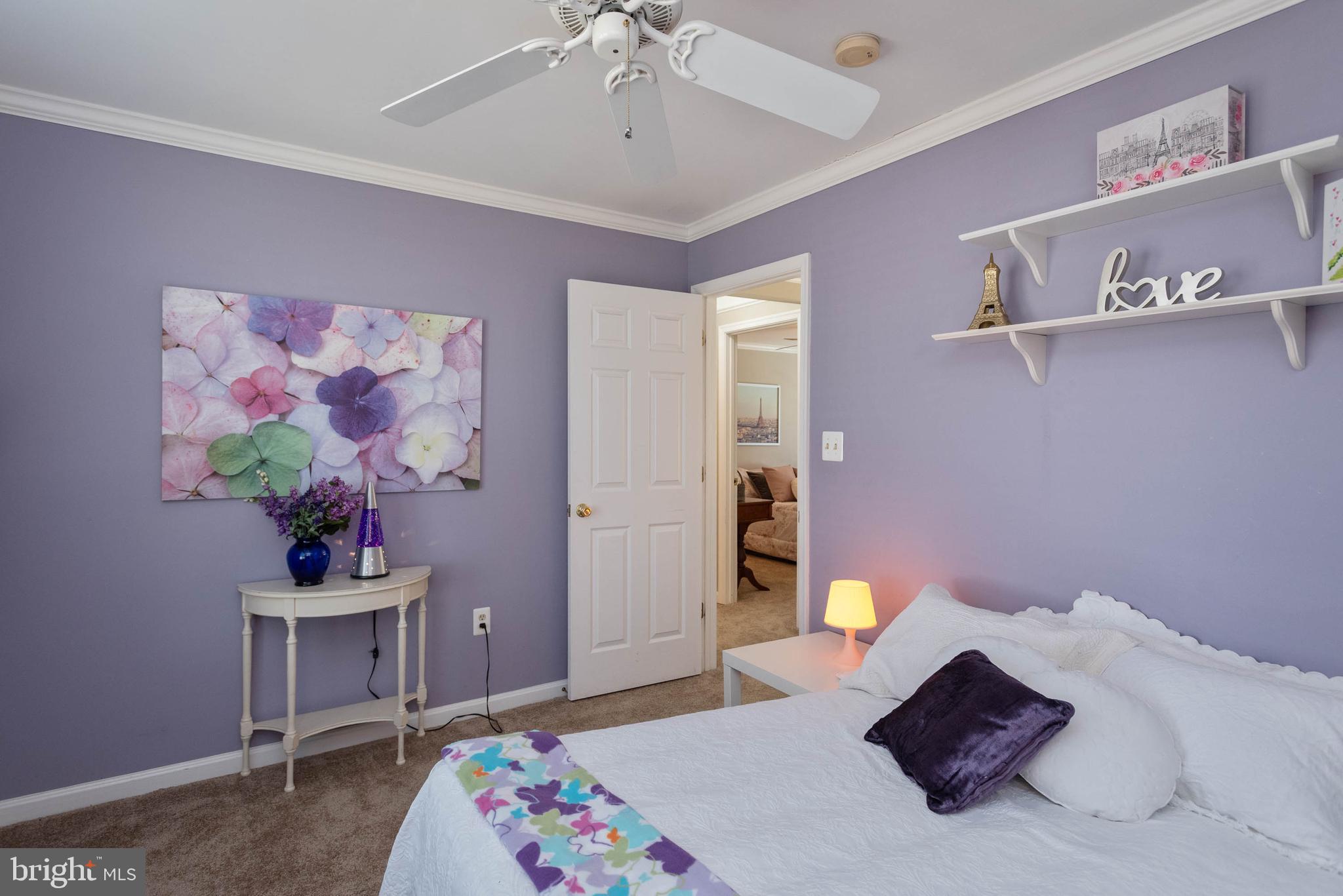 8608 Ashcroft Drive Laurel, MD 20708 - Photo 29 of 45 a bedroom with a bed and a desk
