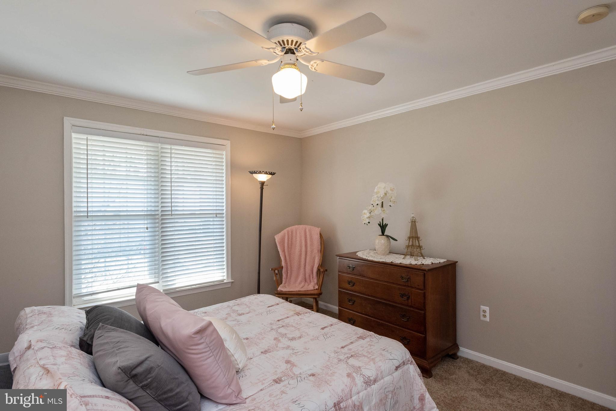 8608 Ashcroft Drive Laurel, MD 20708 - Photo 32 of 45 a bedroom with a bed and a chandelier