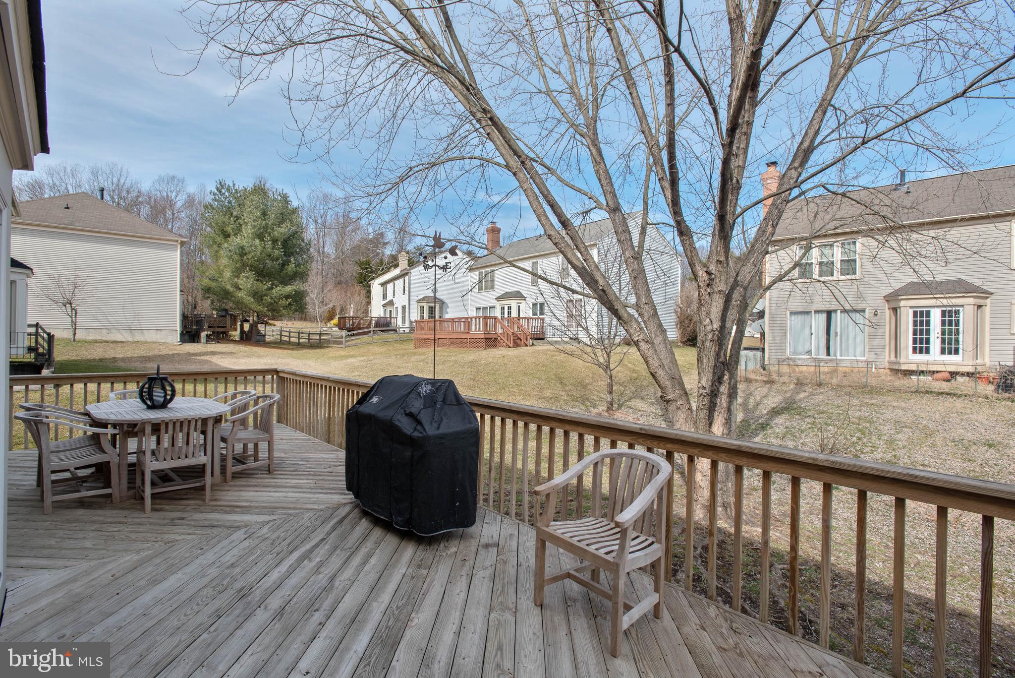 8608 Ashcroft Drive Laurel, MD 20708 - Photo 38 of 45 a view of roof deck with table and chairs and wooden floor
