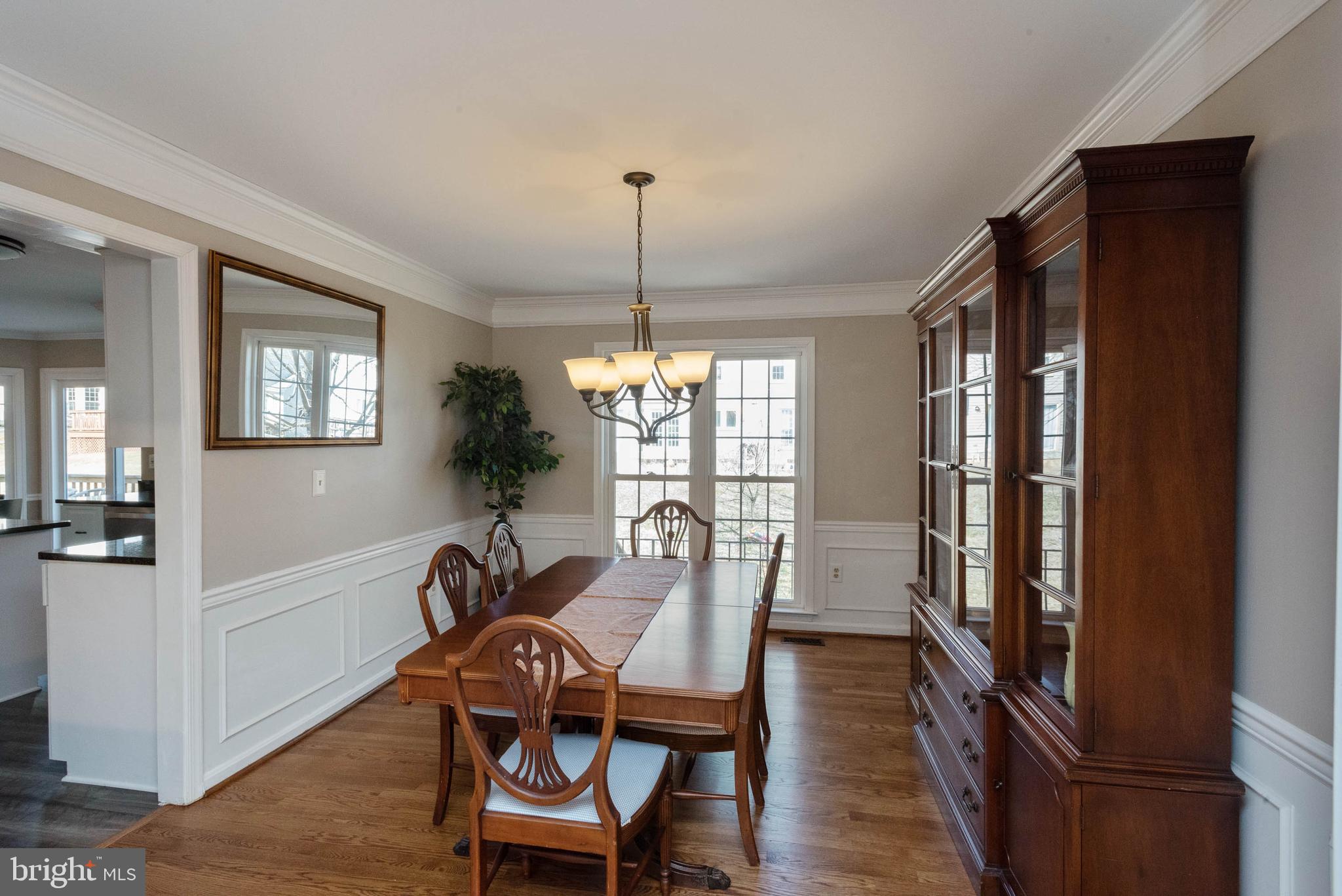8608 Ashcroft Drive Laurel, MD 20708 - Photo 6 of 45 a view of a dining room with furniture window and wooden floor