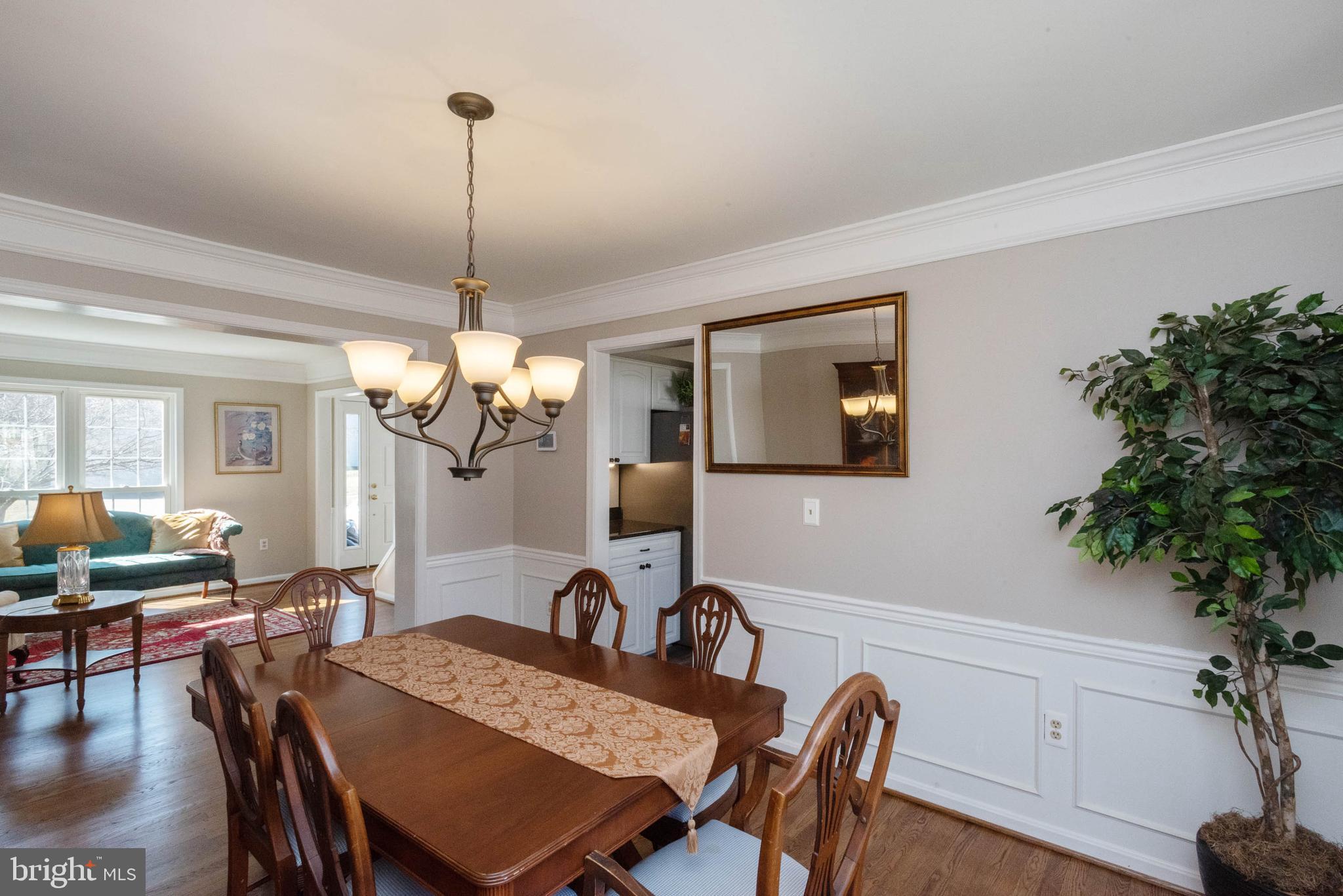 8608 Ashcroft Drive Laurel, MD 20708 - Photo 7 of 45 a view of a dining room with furniture window and wooden floor