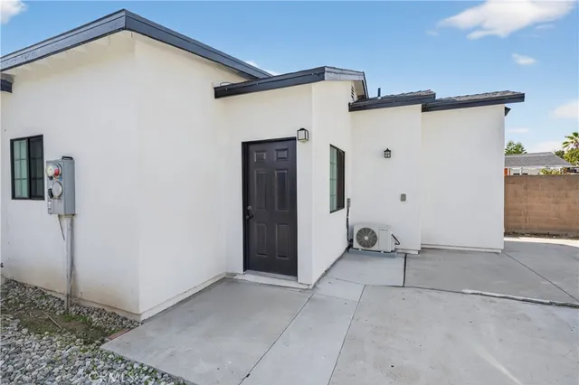 a kitchen with stainless steel appliances granite countertop a refrigerator stove top oven and sink