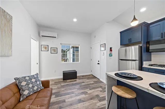 a kitchen with a refrigerator cabinet and a sink