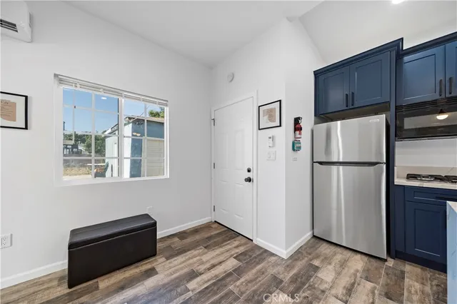 a white refrigerator freezer sitting inside of a kitchen