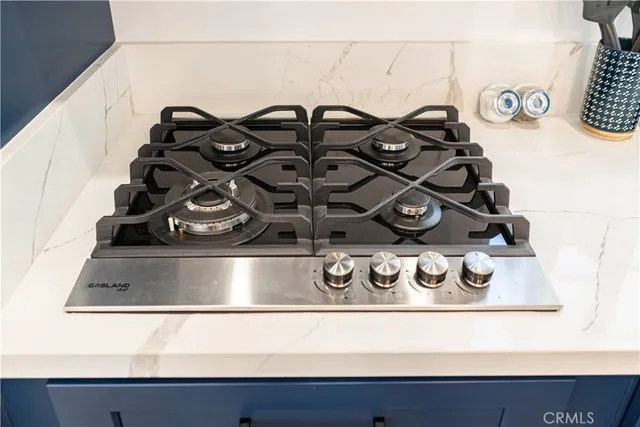 a bathroom with a sink a potted plant and a mirror