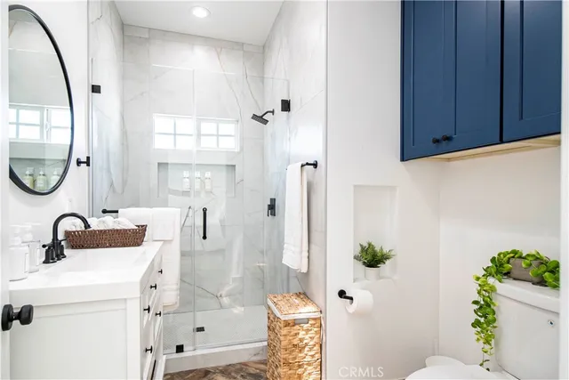 a front view of house with yard and trees in the background