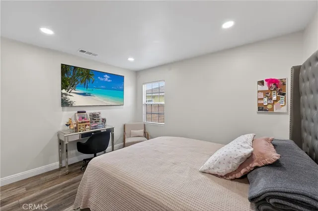 a kitchen with stainless steel appliances granite countertop a stove a sink dishwasher and a refrigerator