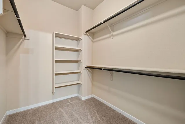 a view of an empty walk in closet