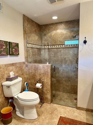 a bathroom with a toilet sink and shower