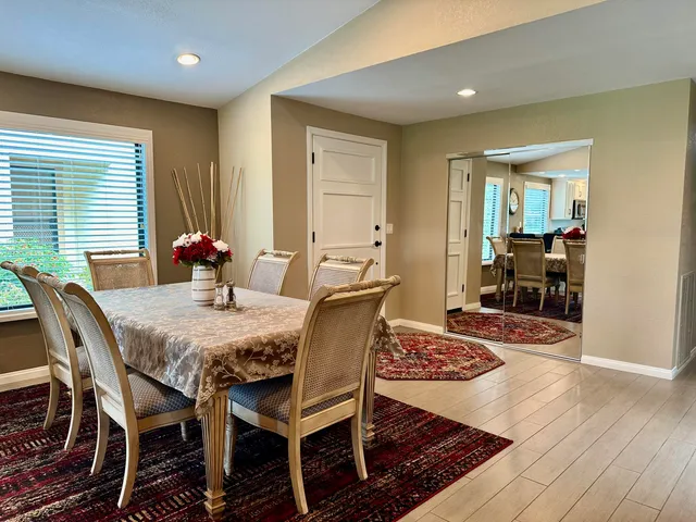 a view of a dining room with furniture window and wooden floor