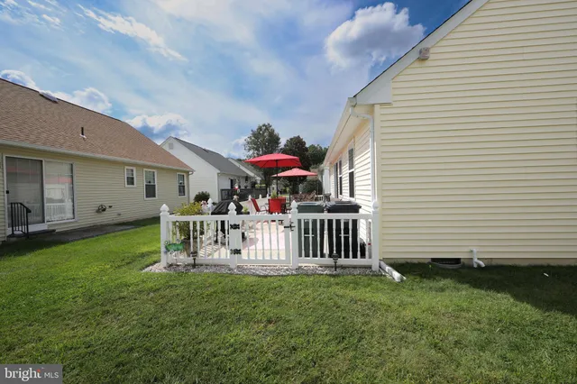 a view of a porch with furniture and garden