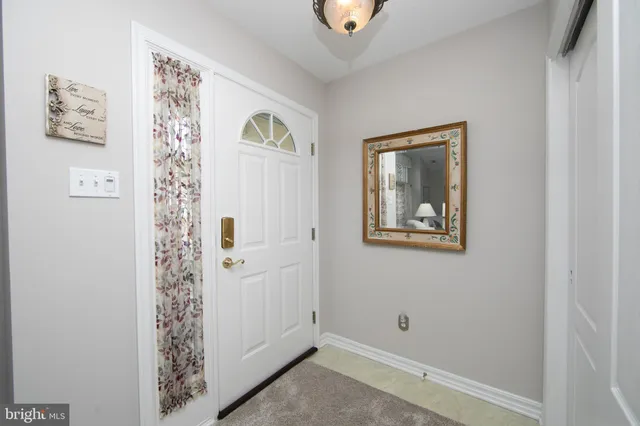 a view of a hallway with closet