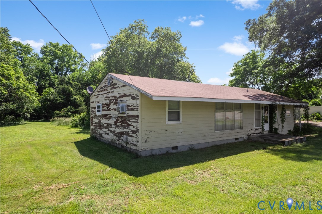 8212 Shady Grove Road Mechanicsville, VA 23111 - Photo 6 of 7 a view of a house with a yard