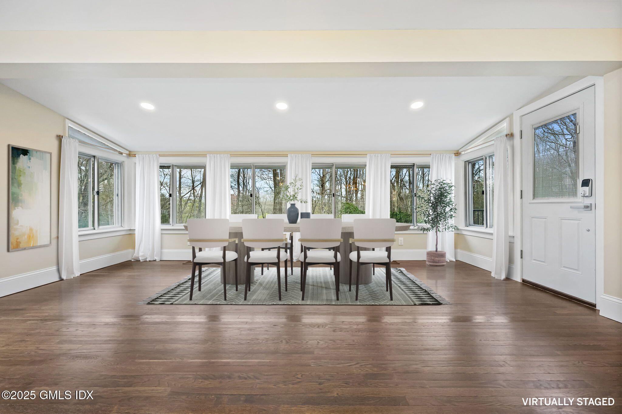 17 Nutmeg Drive Greenwich, CT 06831 - Photo 11 of 35 a dining room with furniture and wooden floor