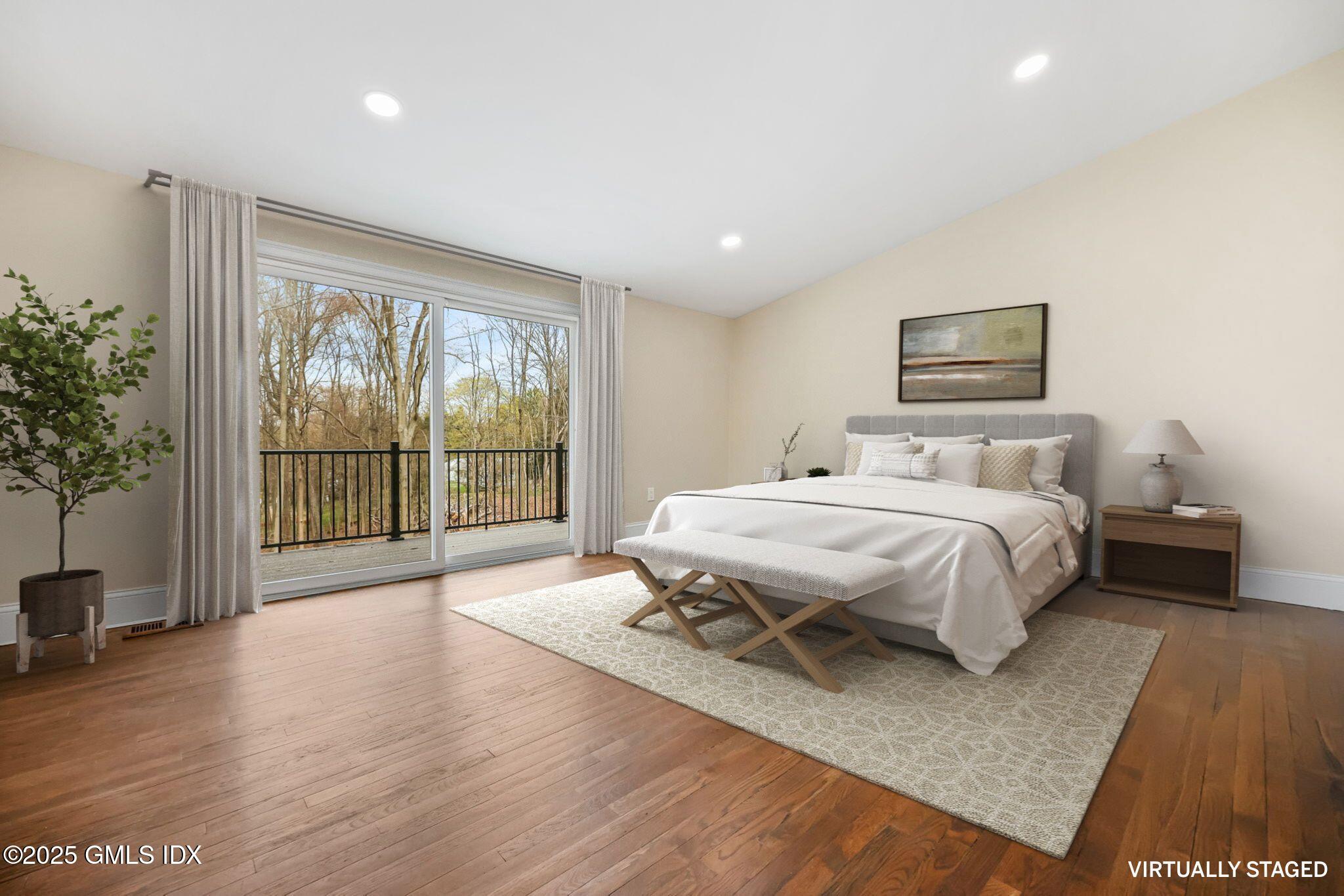 17 Nutmeg Drive Greenwich, CT 06831 - Photo 13 of 35 a bedroom with a large bed and a large window