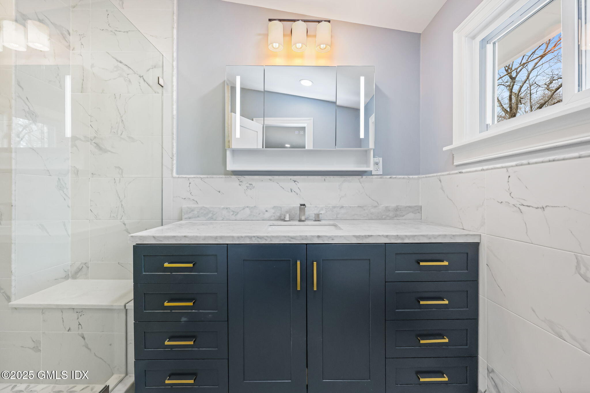 17 Nutmeg Drive Greenwich, CT 06831 - Photo 16 of 35 a bathroom with a granite countertop sink vanity and mirror