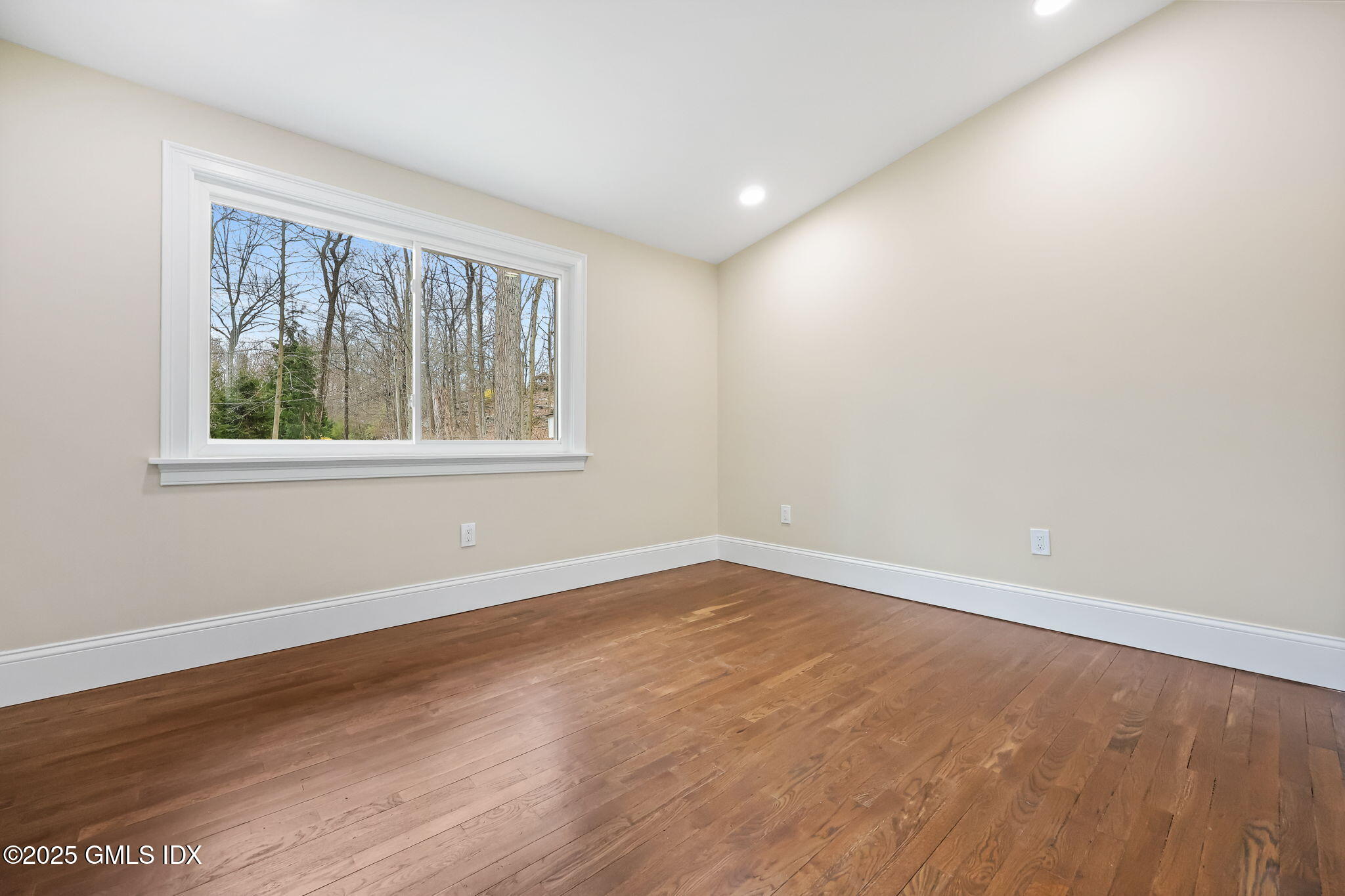 17 Nutmeg Drive Greenwich, CT 06831 - Photo 20 of 35 an empty room with wooden floor and windows