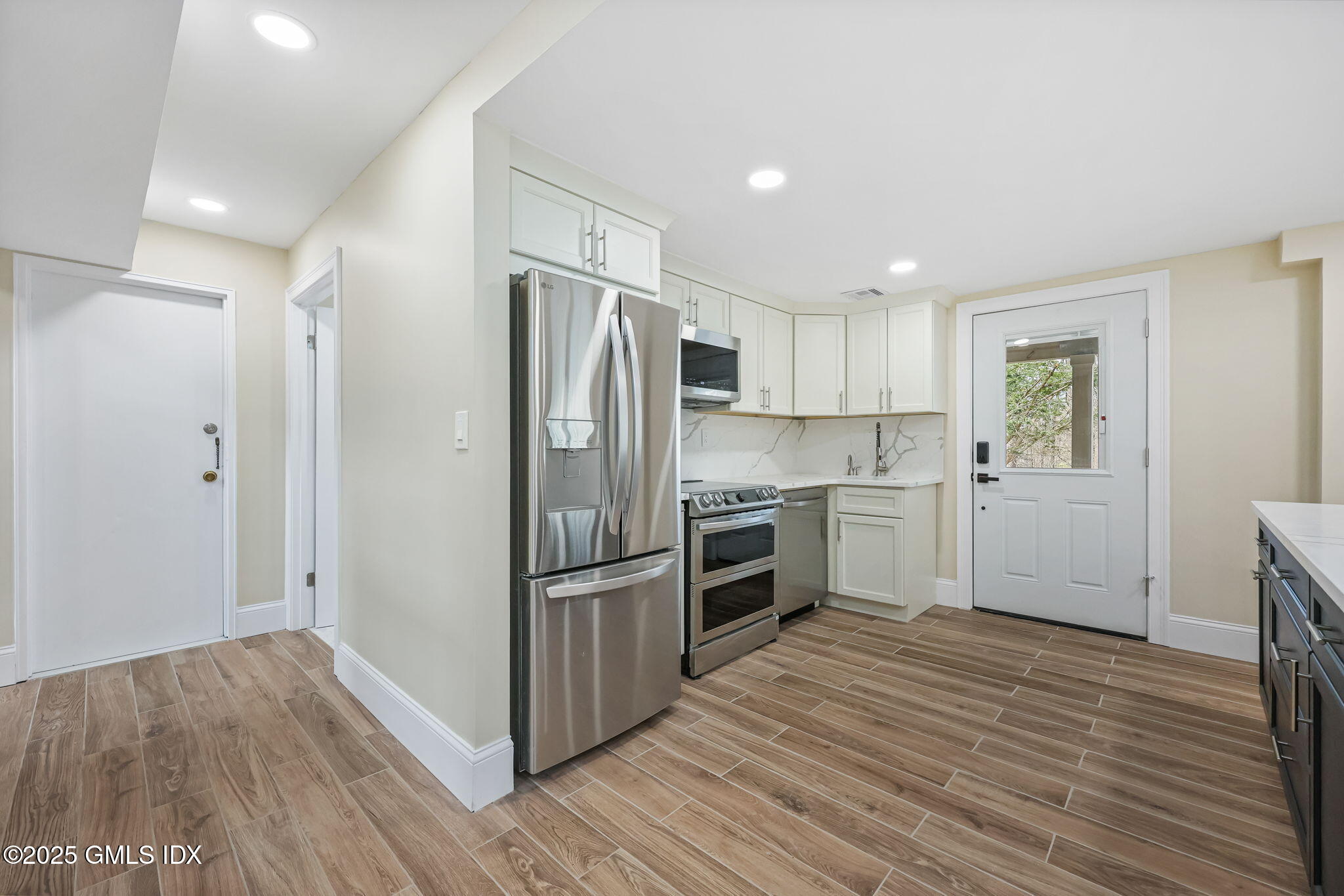 17 Nutmeg Drive Greenwich, CT 06831 - Photo 24 of 35 a kitchen with granite countertop a refrigerator and a sink
