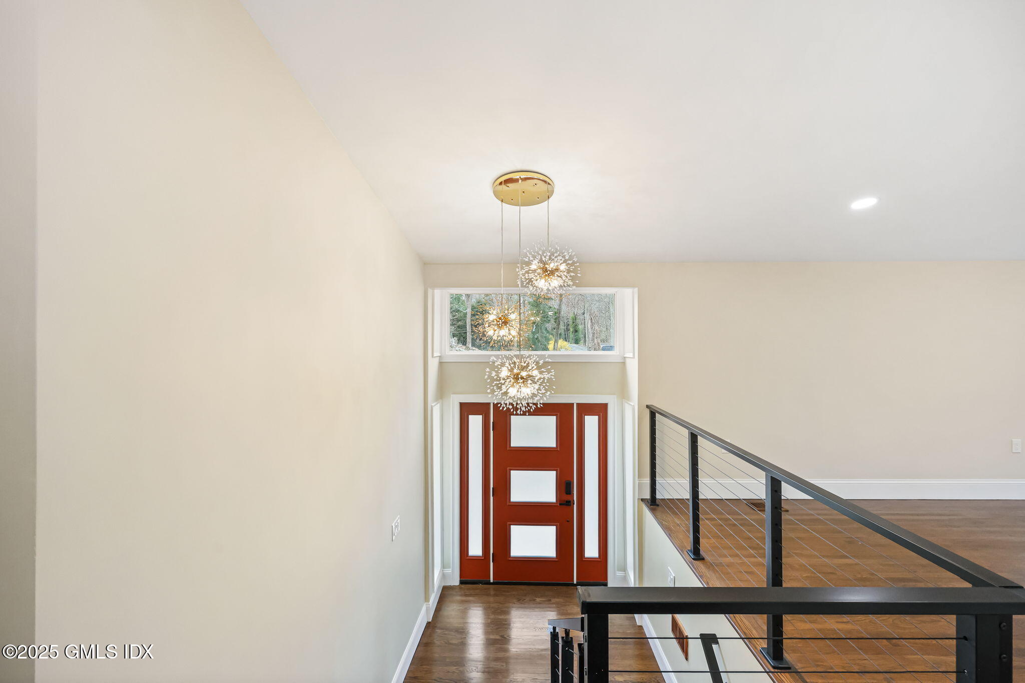17 Nutmeg Drive Greenwich, CT 06831 - Photo 5 of 35 a view of a hallway with wooden floor and staircase