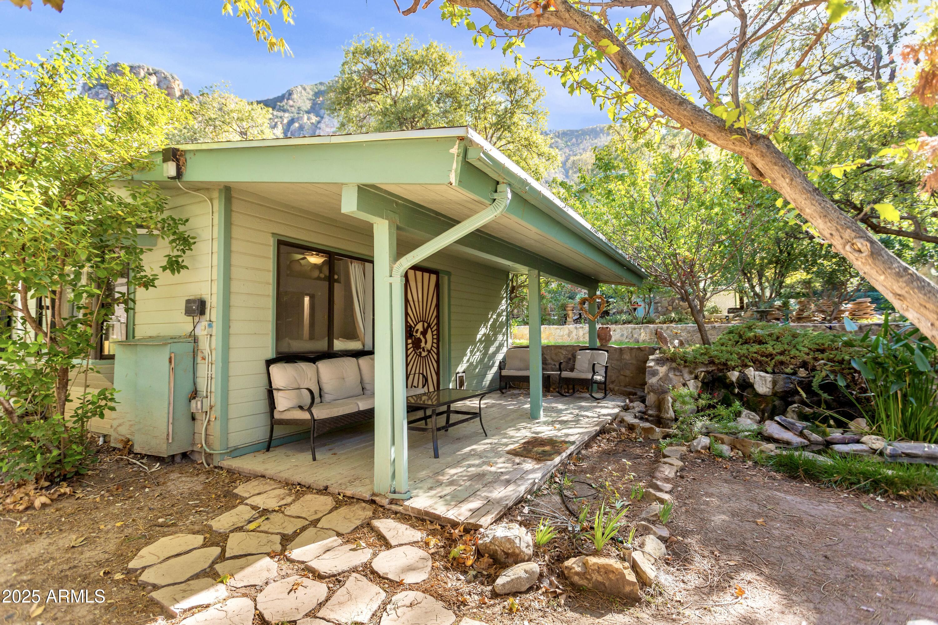 29 East Ramsey Canyon Road Hereford, AZ 85615 - Photo 102 of 119 a backyard of a house with barbeque oven table and chairs